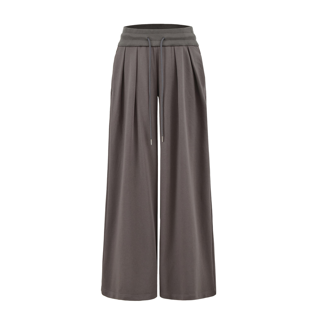 High waisted wide legged floor hugging sports pants